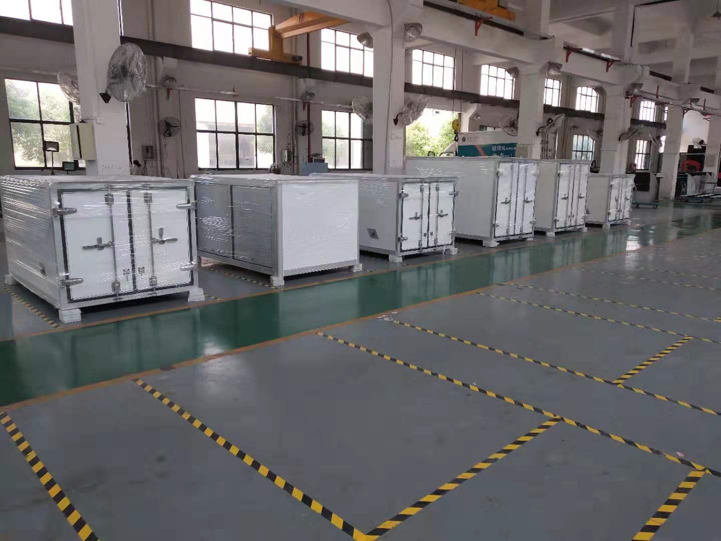 Composite truck bodies lined up on the HOTECH factory floor