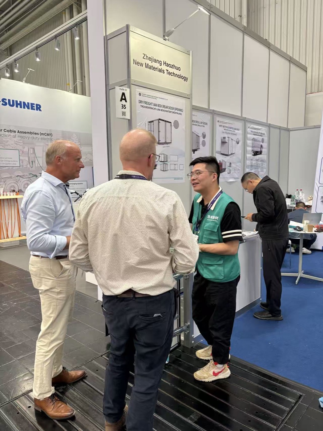 HOTECH engineer meeting visitors at the booth